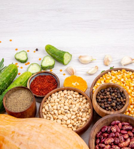 top-view-fresh-foods-spices-vegetables-bottom-white-table